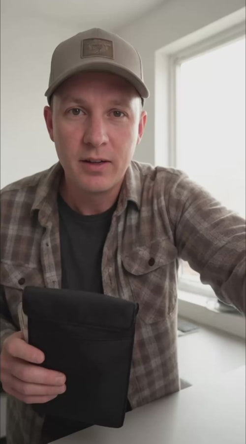 NullSignal customer testimonial video — man demonstrating the Faraday pouch